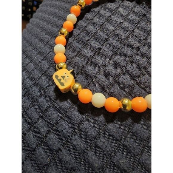 Handmade Orange and White Halloween Stretch Bracelet with Pumpkin - Picture 10 of 11